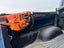 ORANGE CHAINSAW IN A SAWHAUL SNAP LOK ON A TOYOTA BED RAIL