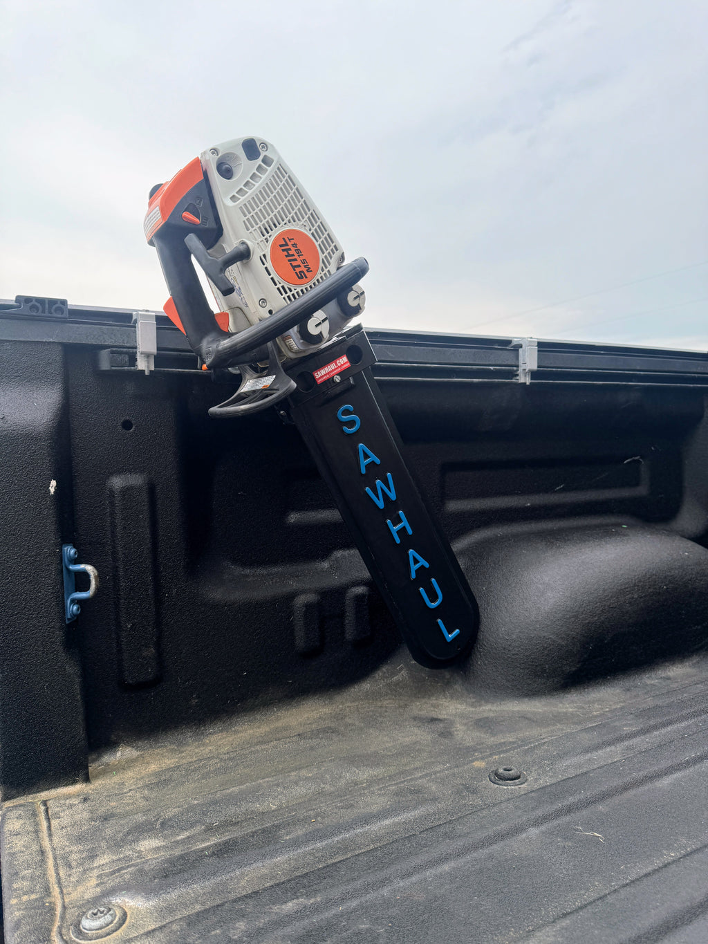 TOYOTA BED RAIL MOUNT SAWHAUL WITH CHAINSAW.