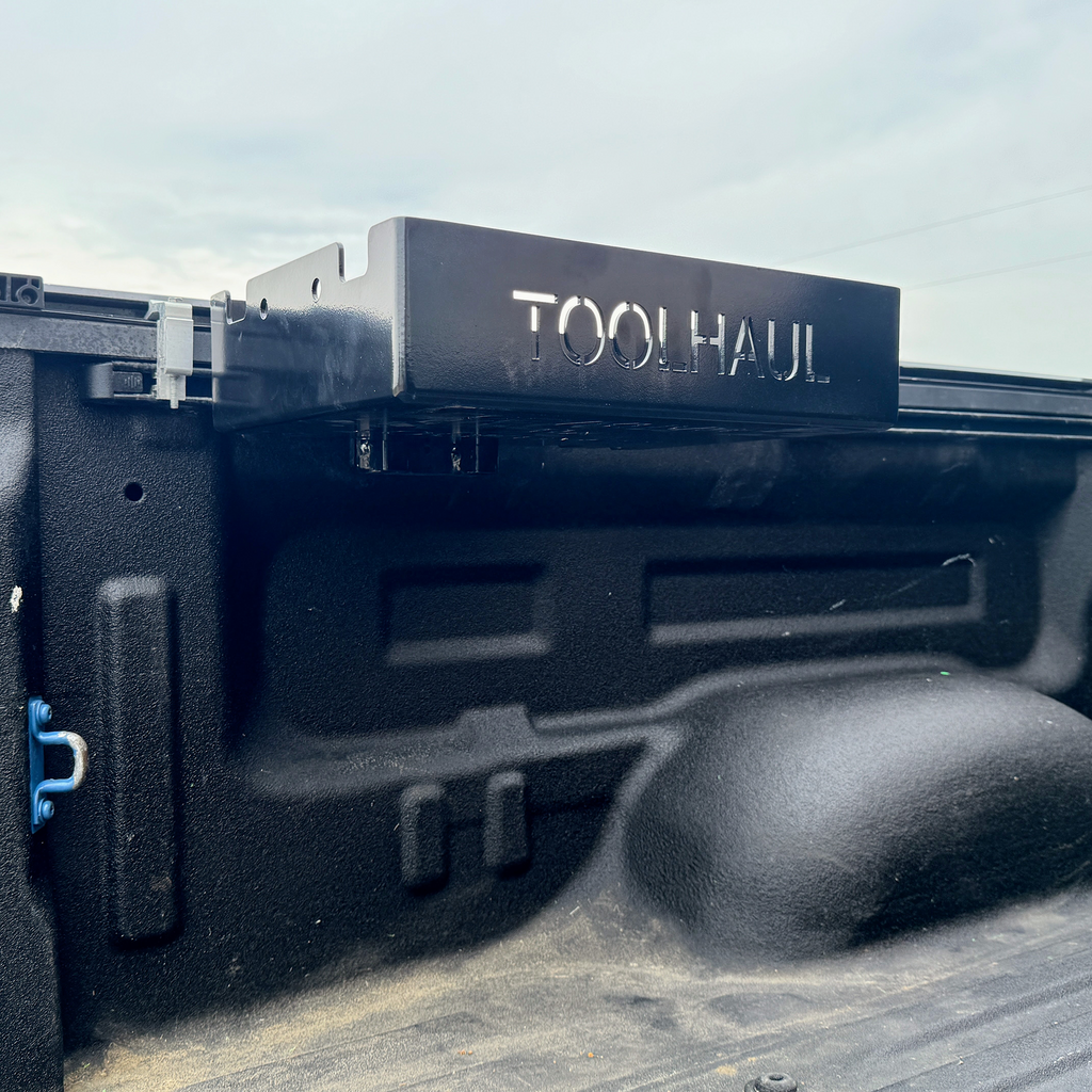 Toolhaul Snap-Lok Mount on Toyota truck bed storage system with 'Toolhaul' branding. 