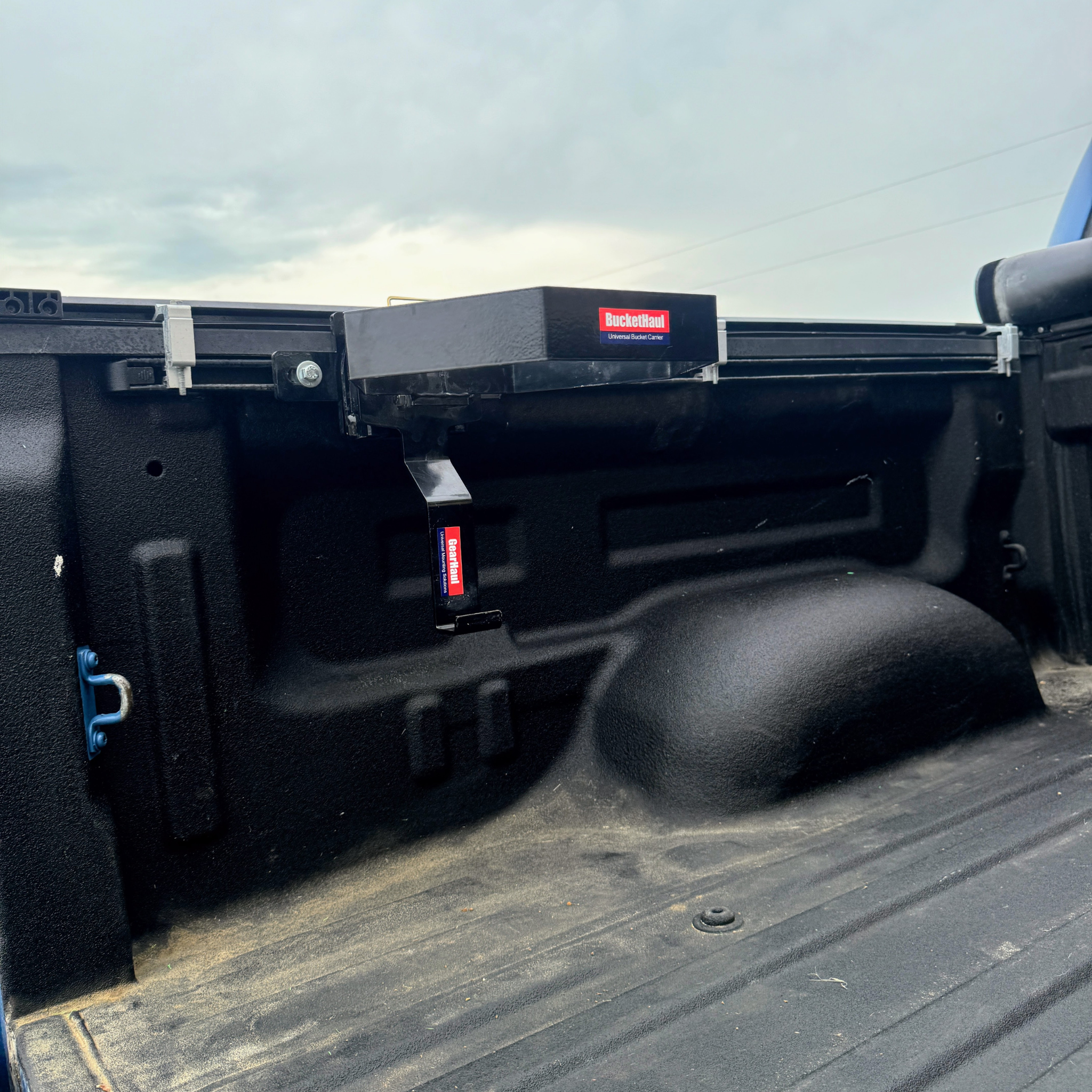 Toyotal Truck bed with a Buckethaul and visible branding attached to bed rail.