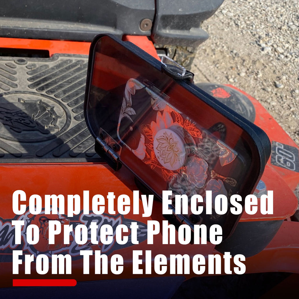 Close-up of aCallHaul Magnet Mount Cell Phone Caddy by GearHaul on a orange lawnmower