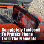Close-up of aCallHaul Magnet Mount Cell Phone Caddy by GearHaul on a orange lawnmower