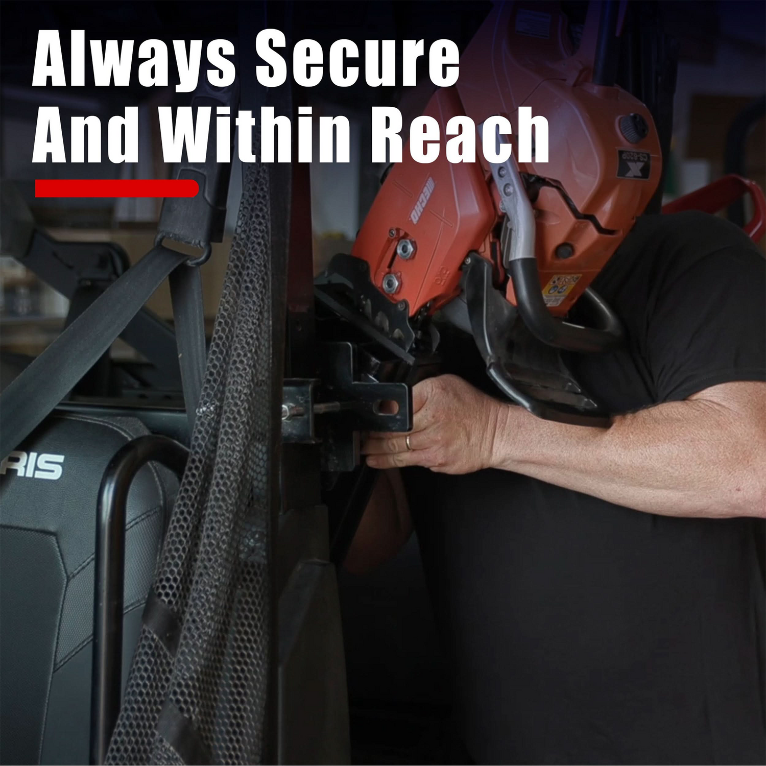Person securing a chainsaw to a Polaris ATV  with text 'Always Secure And Within Reach' displayed.