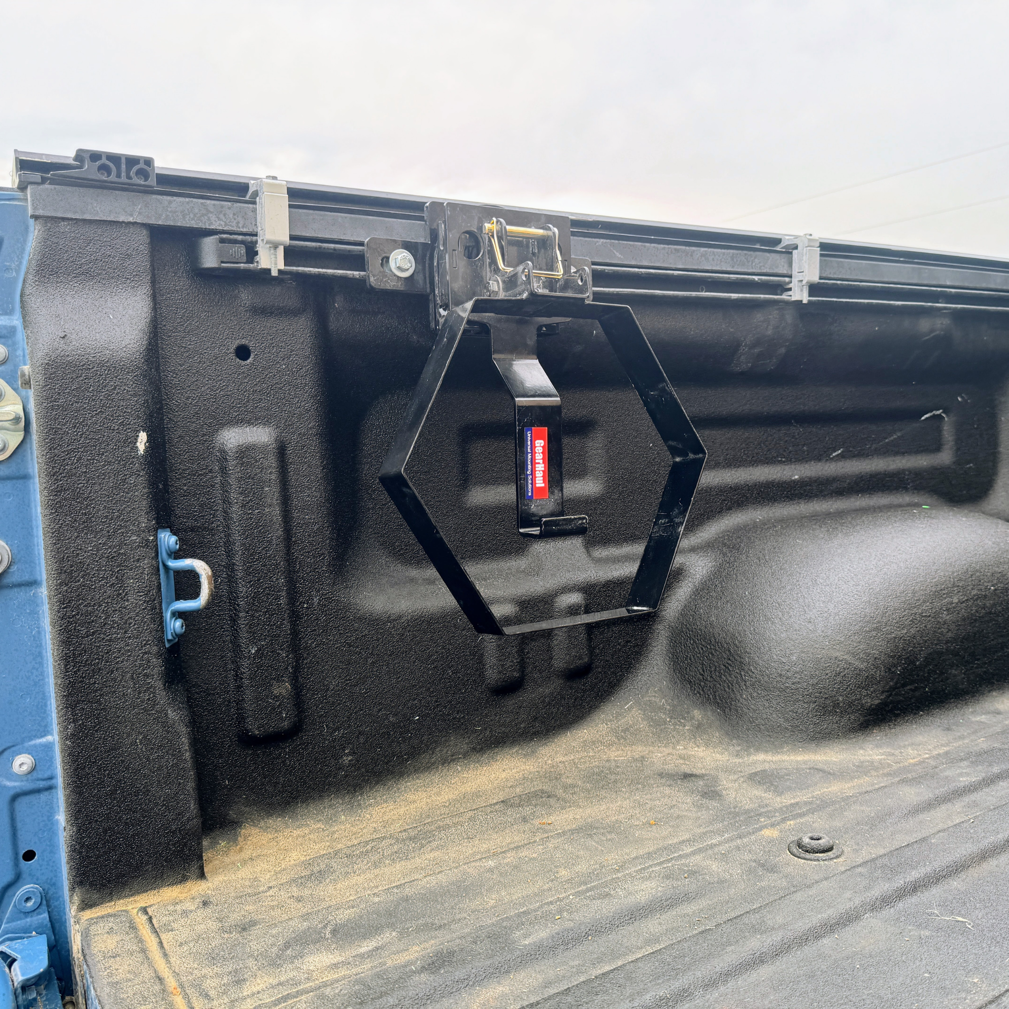 Close-up of a black GearHaul bracket on a Toyota truckbed
